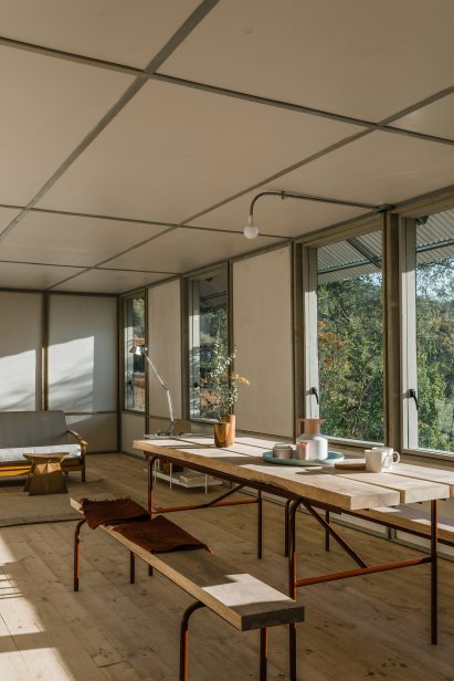 Wood-clad dining area within Chilean housing prototype