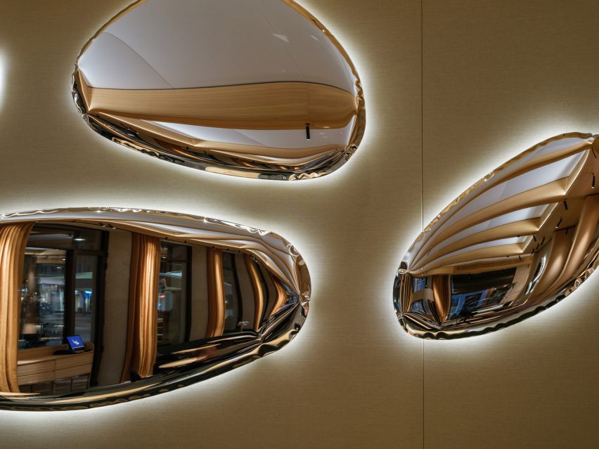 Organically shaped chrome wall lights