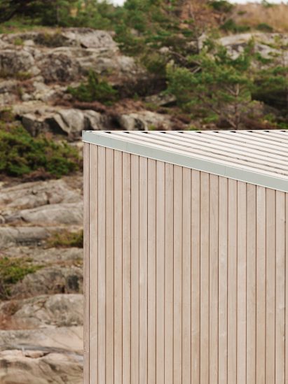 Ash cladding of Kjerringholmen cabin by Line Solgaard Arkitekter