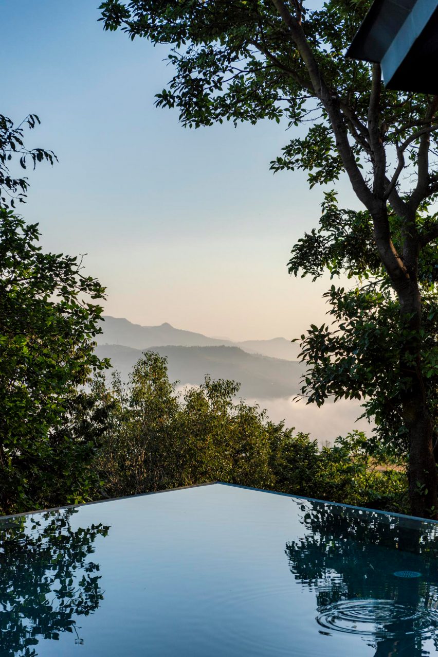 Corner of an infinity pool overlooking treetops