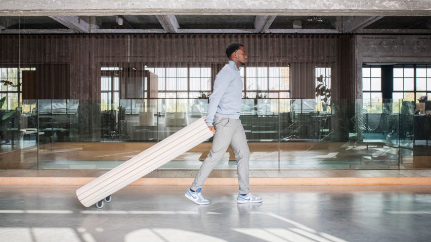 Foldable Mono study pod by Bogaerts being rolled away by a person