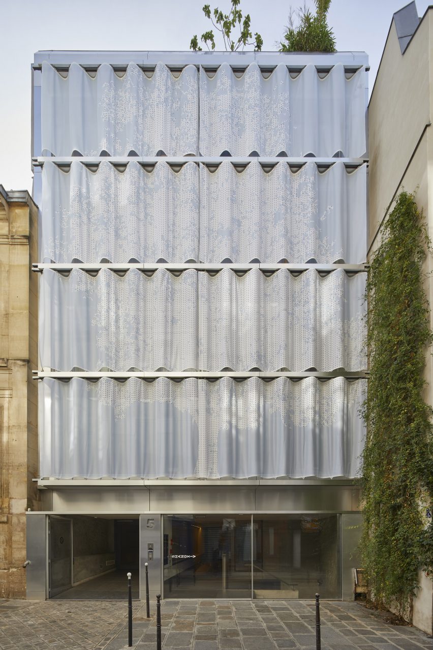 Multi-storey mixed-use building with curved moveable PVC curtain wall