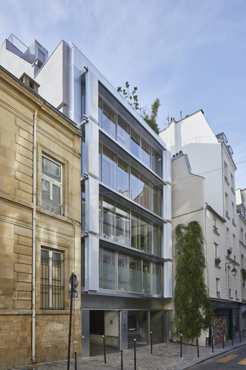 A flat roof building with curved PVC moveable curtain wall fully open