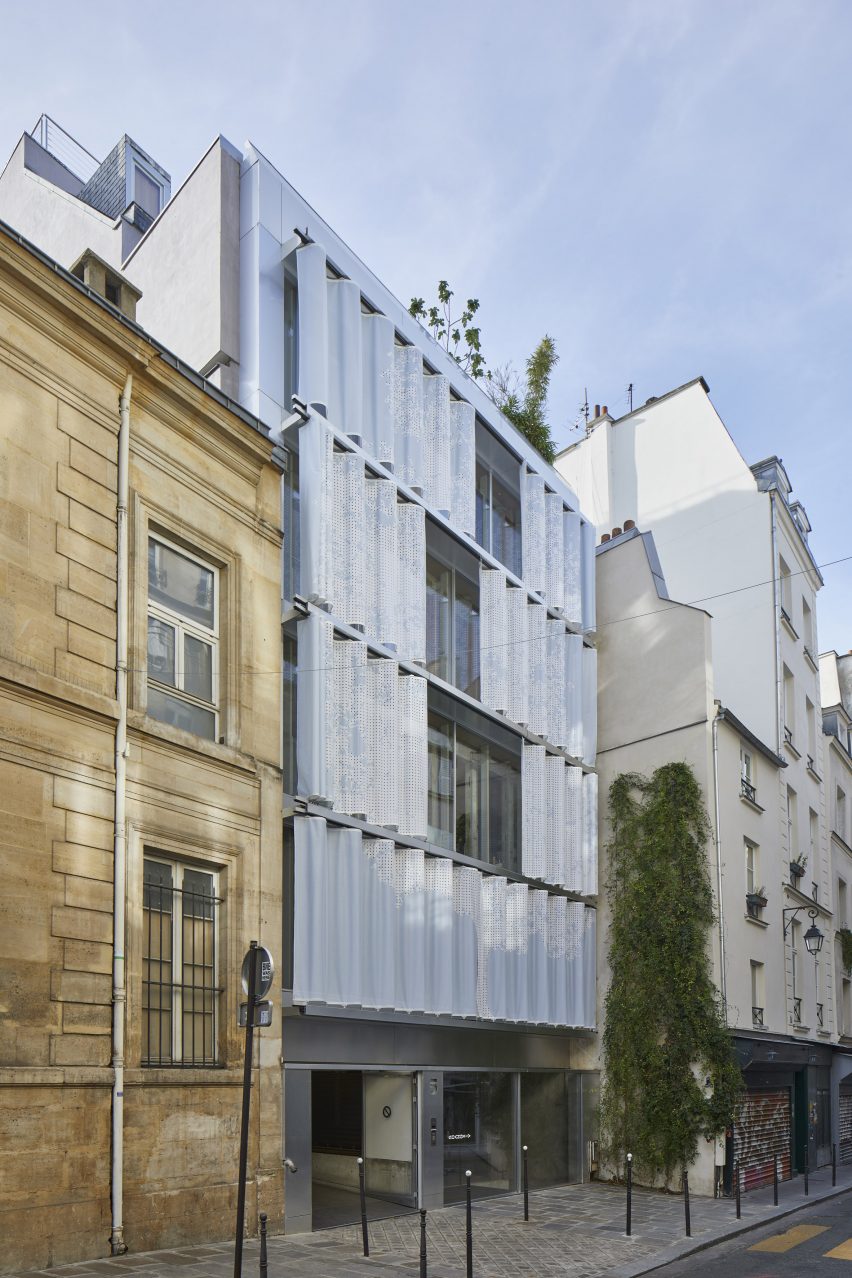 Multi-storey mixed-use building with curved moveable PVC curtain wall