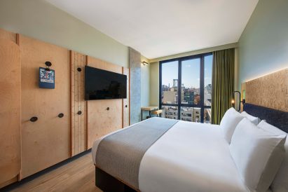 Hotel bedroom by Basile Studio