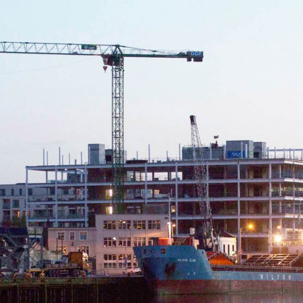 Industrial building on a harbour with a crane