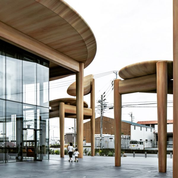 Nikken Sekkei shelters Japanese sweet company HQ with oversized table and chairs