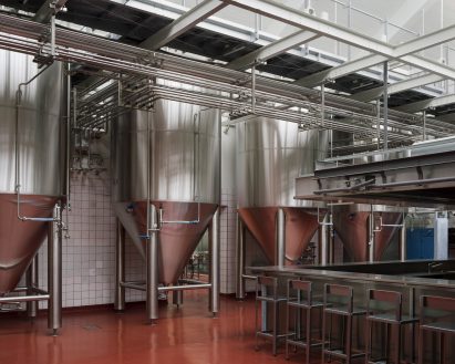 White tiles lining the walls of ÅBEN brewery in a former slaughterhouse