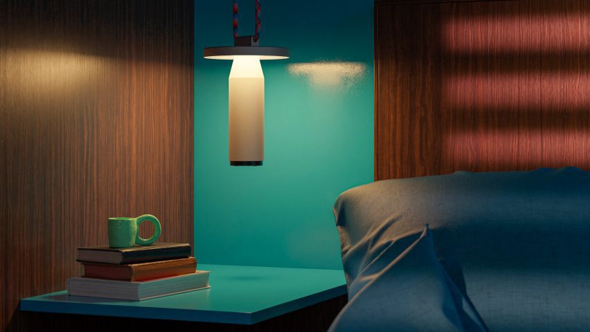 Lamp hanging beside bed