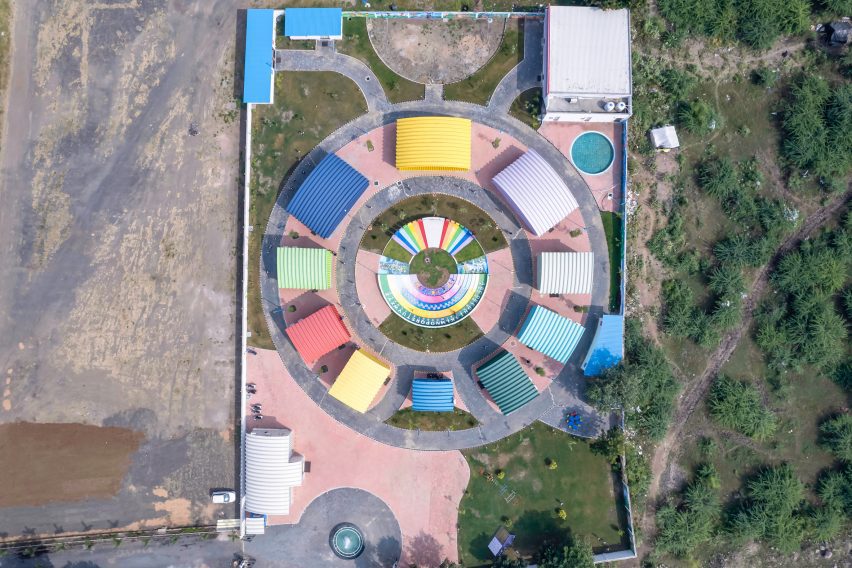 Aerial view of colourful metal school sheds an a circle