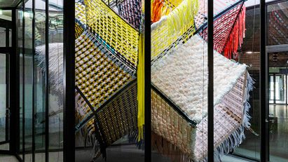 Loom Room woven installation in a glass atrium