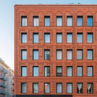 Exterior of the red-brick Grand Mulburry building by Morris Adjmi with a textured facade
