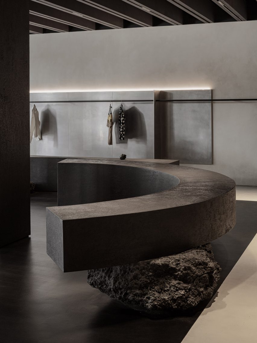 Curved bench balanced on rocks