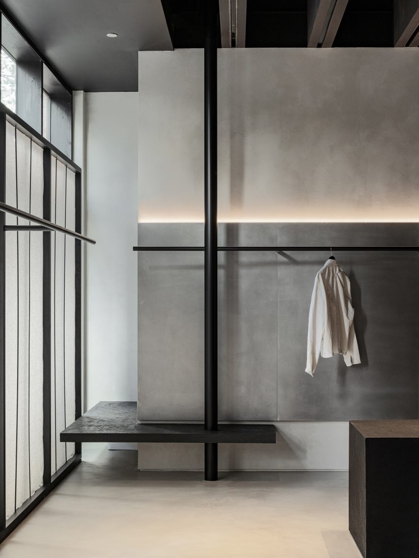 Thin black rails for displaying clothing