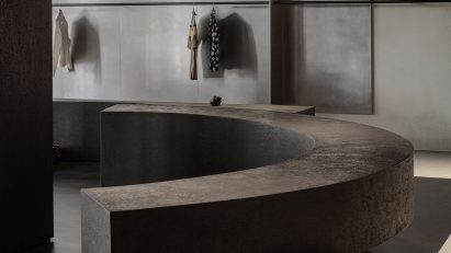 Curved bench balanced on rocks