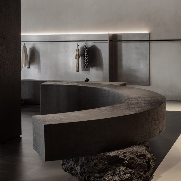 Curved bench balanced on rocks