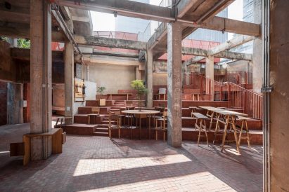 Courtyard area with steps and wooden furniture