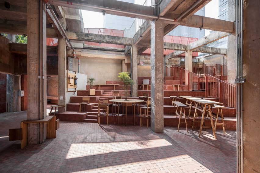 Courtyard area with steps and wooden furniture