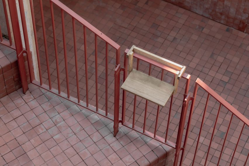 Detail of railing with small shelf table mounted onto it