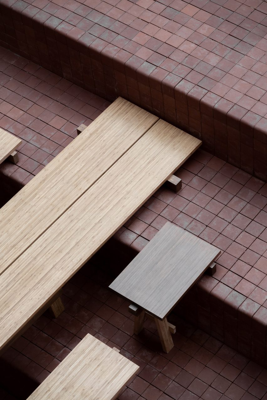 Benches and table balanced on step with two front legs