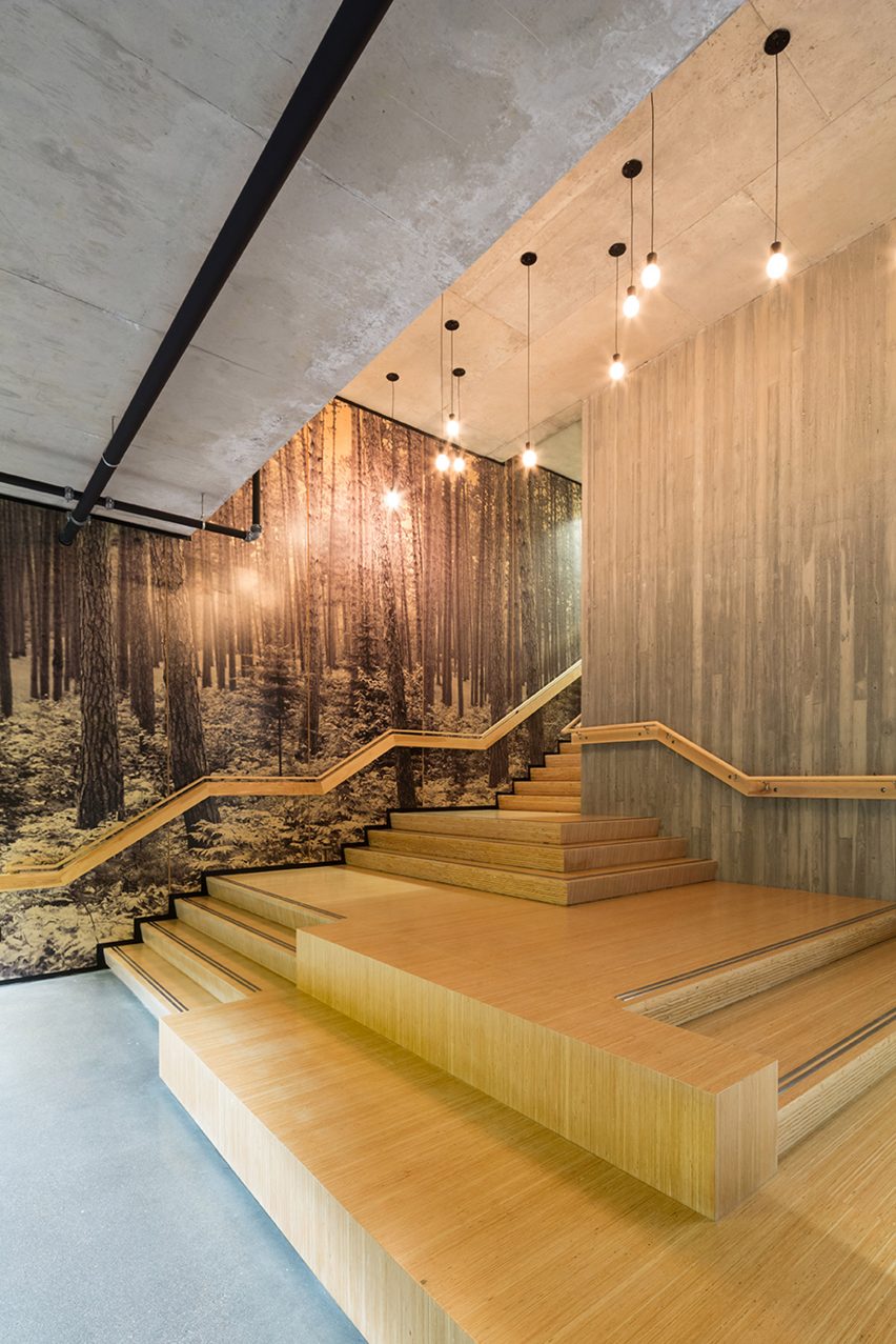 The bottom of a timber staircase with wide steps