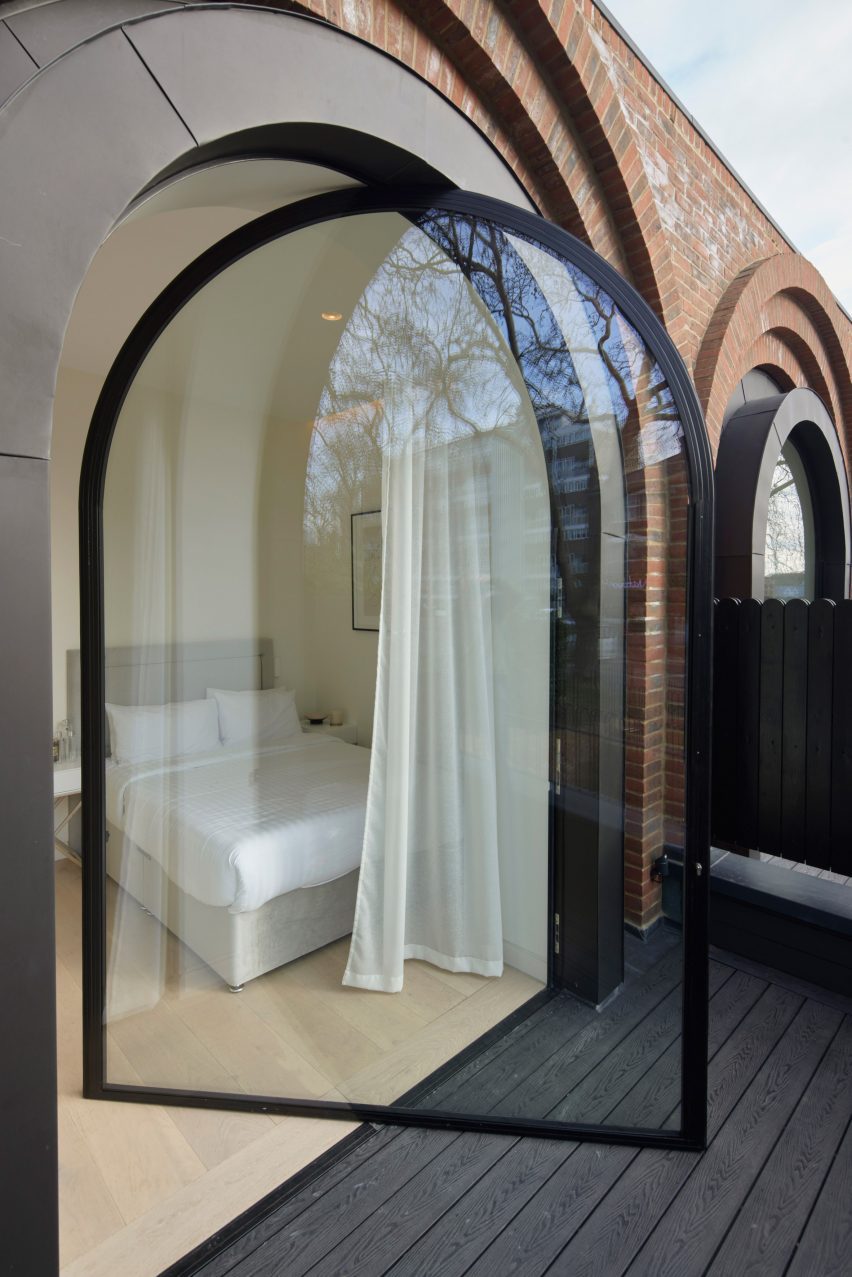 Pivoting window leading itno bedroom, The Arches townhouses by The DHaus Company