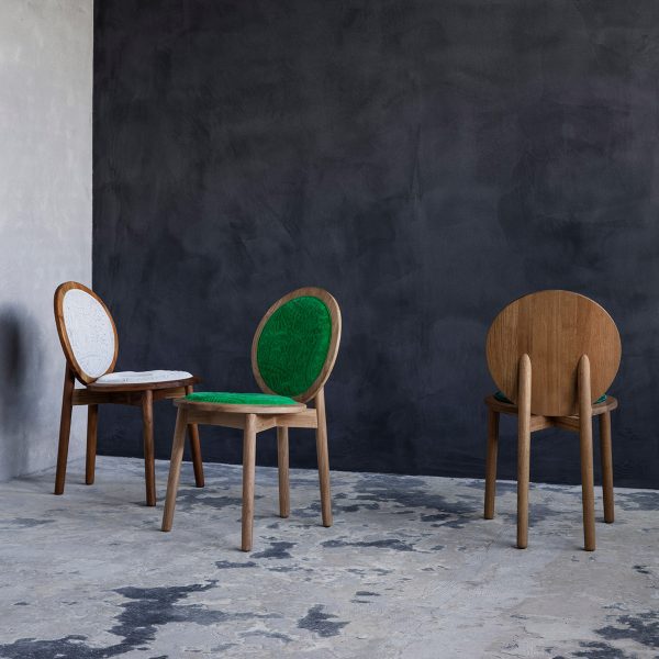 Three wooden chair with circular white and green upholstered seats by Ca'lyah