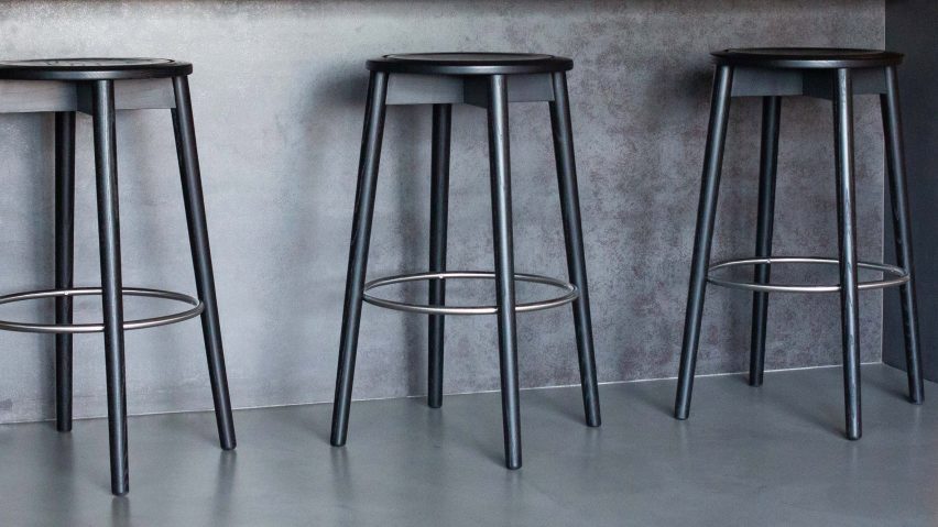 Wooden stool under grey counter