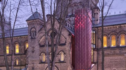 Contemporary elevator added to gothic-style building
