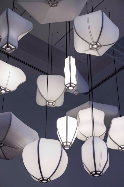 Photograph showing cluster of lights hung from ceiling