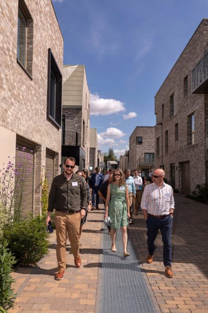 People walking through a narrow street
