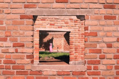 View of child and teacher at Wayair School in Tanzania by Jeju Studio