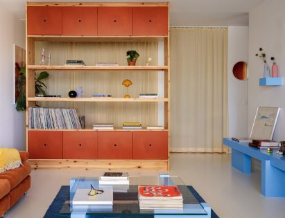 Living room interior with red cupboards and blue table