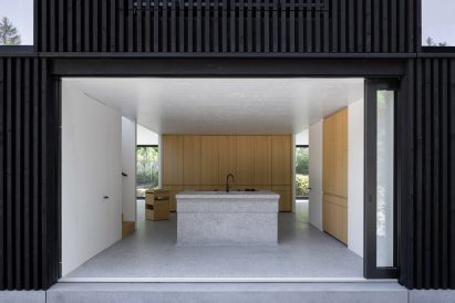 Kitchen with sliding glass wall