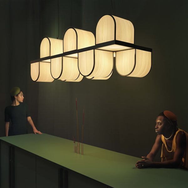 Photo of two people under a light installation