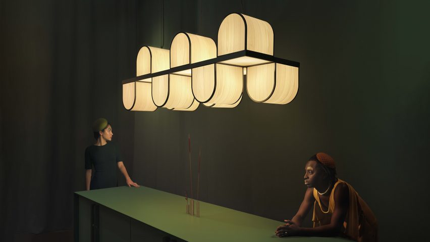 Photo of two people under a light installation