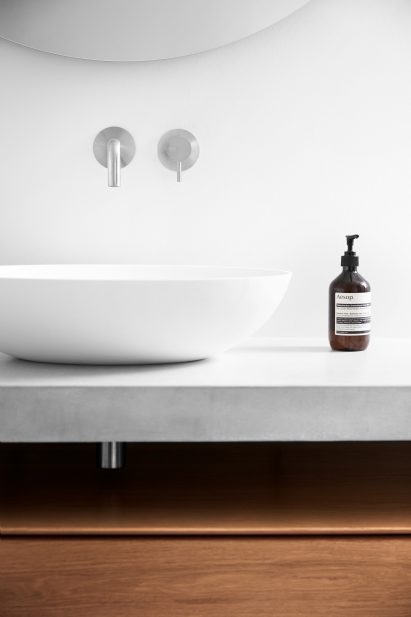 D line tabs fashioned above a white sink