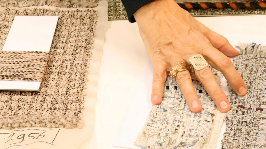 Photo of a hand touching textiles