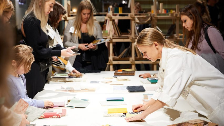 Photo of people looking at fabrics