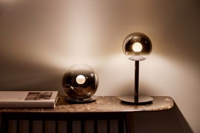 Occhio's lamps sitting on a table