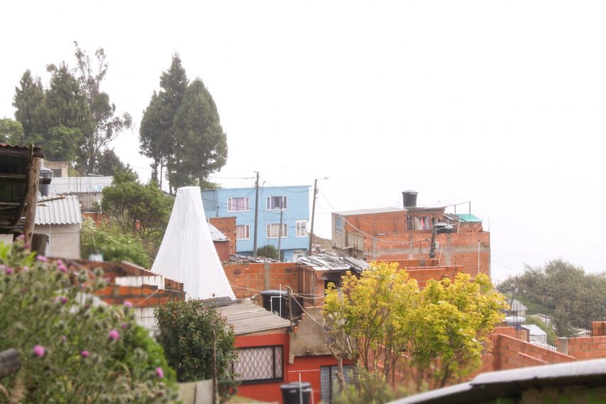Water harvester in distance with buildings