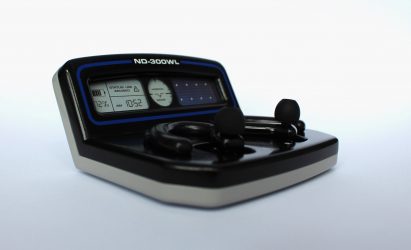 Device with tabletop and in-ear components on grey gradient background