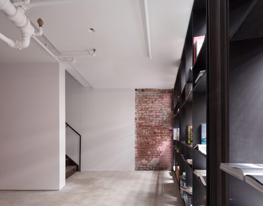 A staircase leads down to more space at cellar level