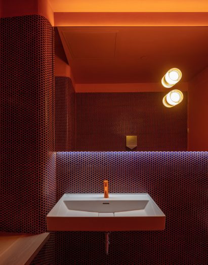 Orange public bathroom