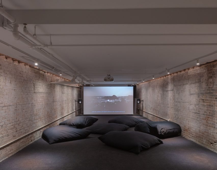 The dark cellar space is used for film screenings