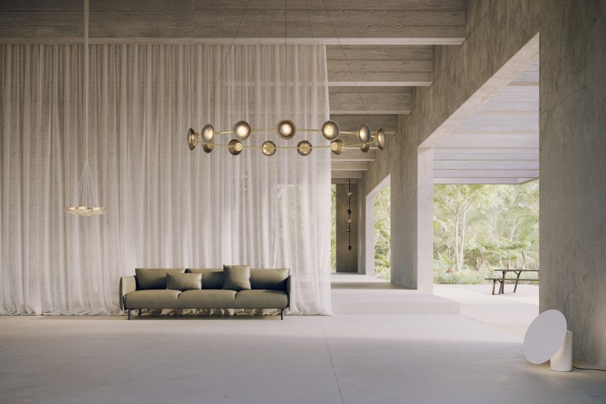 Ceto Circlet chandelier by Ross Gardam in an open living space with a green sofa