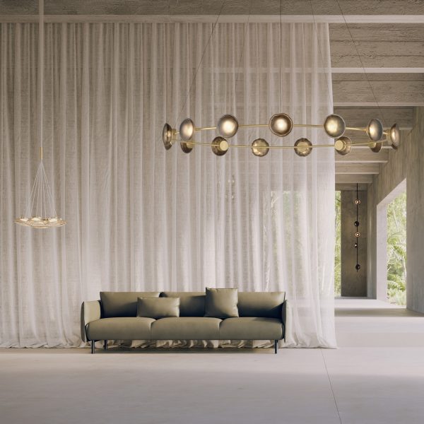Ceto Circlet chandelier by Ross Gardam in an open living space with a green sofa