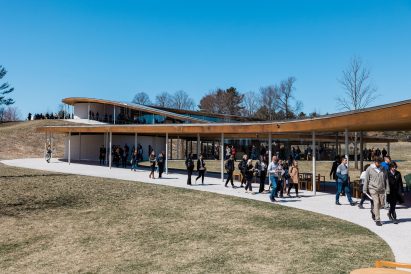 People walking at SANAA building at Grace farms