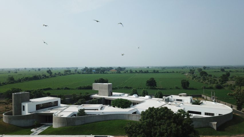 Wide shot of the exterior of the Enclosure concrete house complex by Design Ni Dukaan