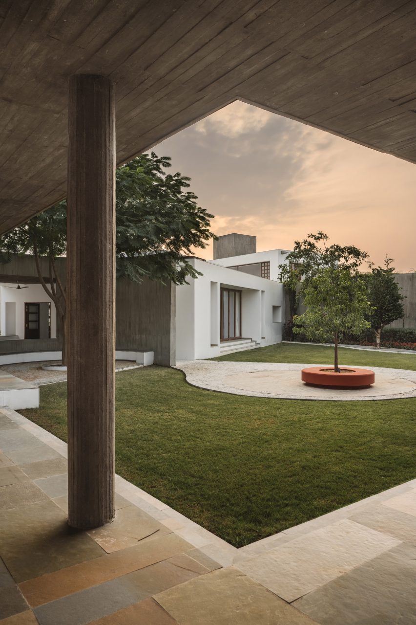 Grass courtyard with a surrounding covered walkway